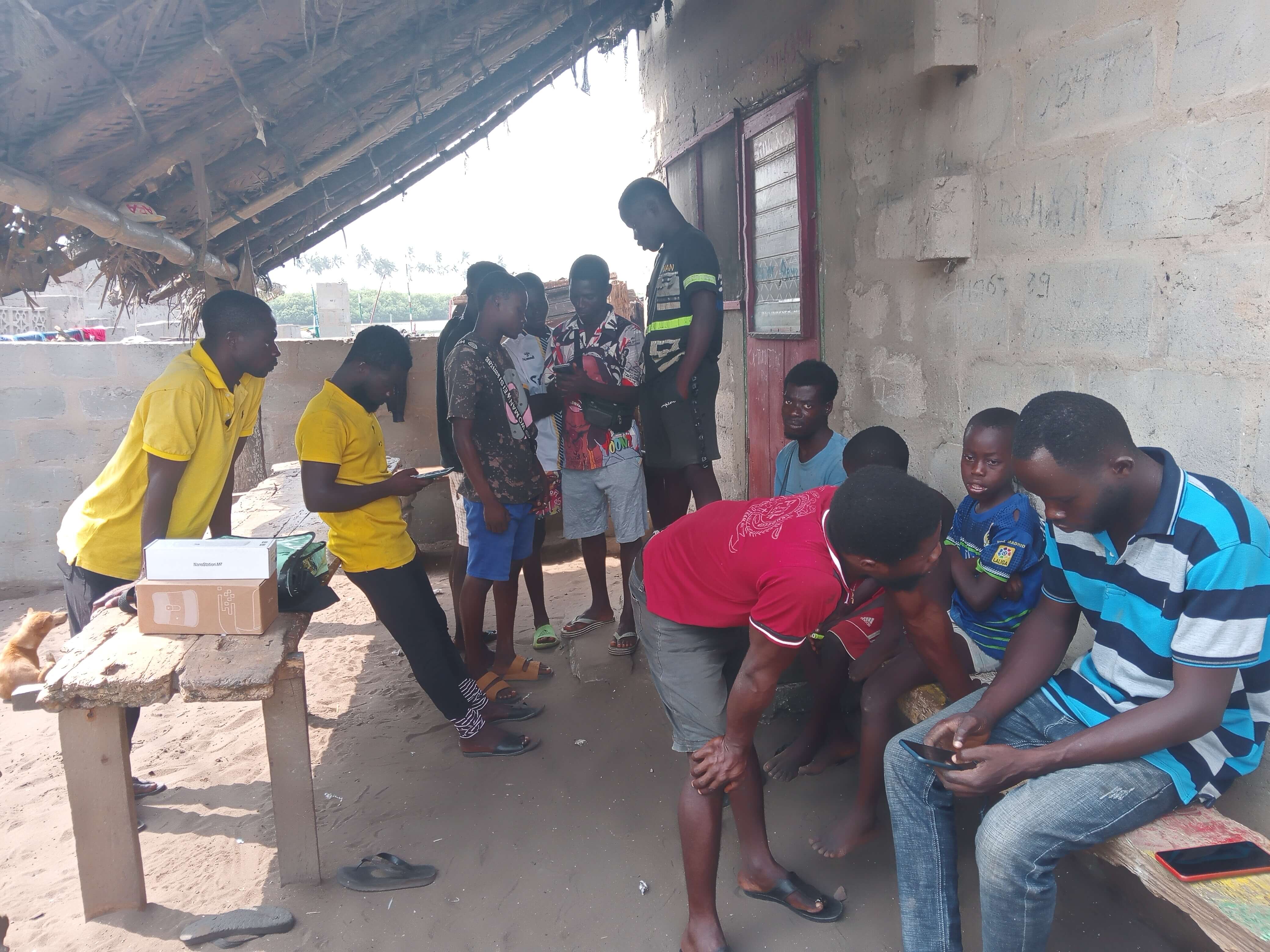 Residents checking their phones for signal in Kuntu