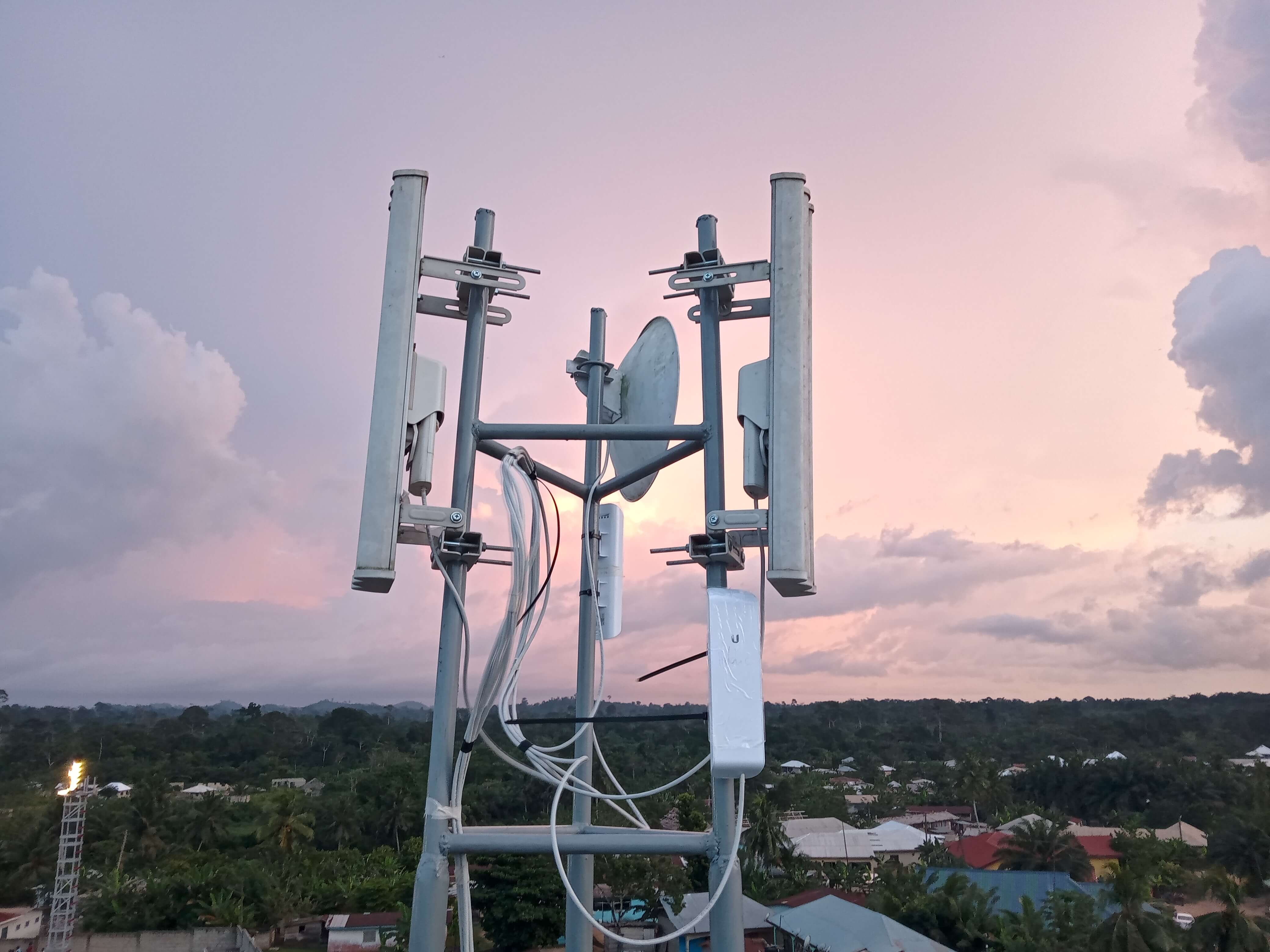 Samreboi base station tower at sunset overlooking the township